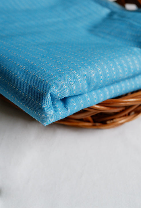 Baby blue handloom cotton with white interwoven threads